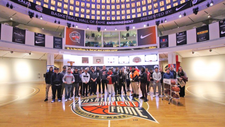 A group of students posing for a photo while on tour of the Basketball Hall of Fame. 