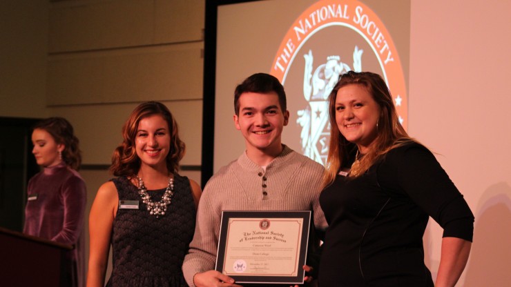 Student pictured with staff members at the National Society for Leadership & Success award ceremony.