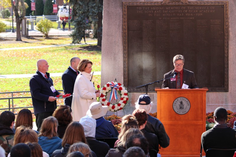 image of a crowd listening to a speaker at the dean college veterans day ceremony on campus.